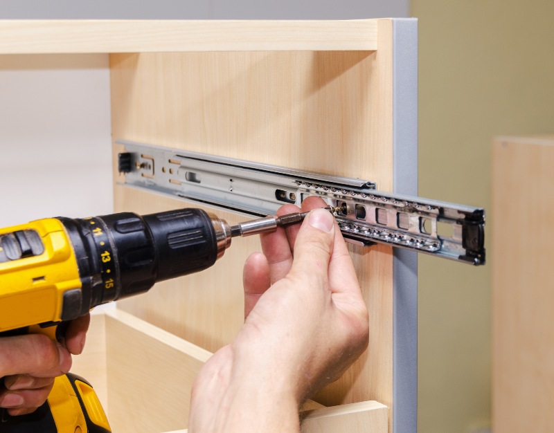 Assembling furniture with an electric screwdriver in Houston