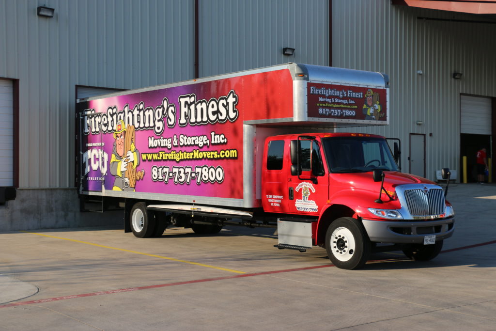 moving truck parked at warehouse parking lot