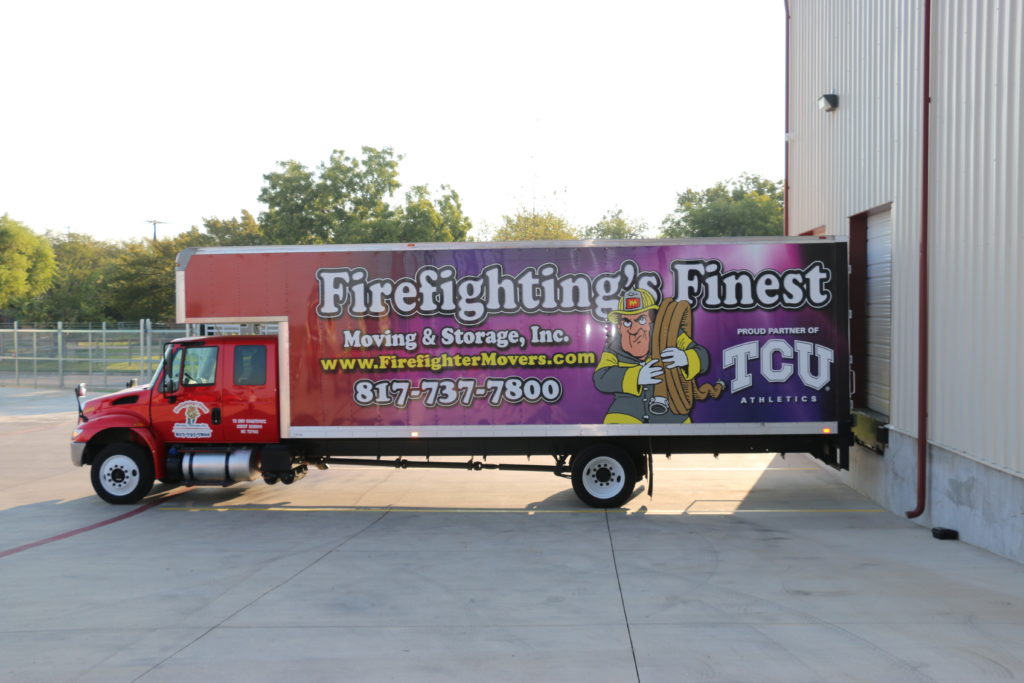 moving truck parked in warehouse parking lot